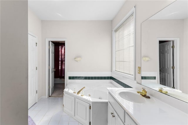 bathroom featuring vanity, tile patterned floors, and a bathtub