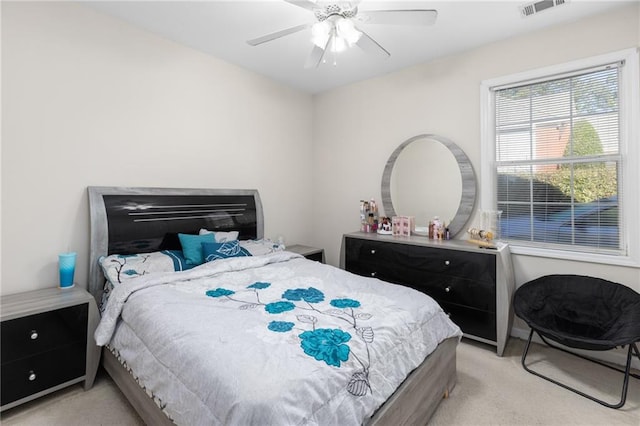 bedroom featuring ceiling fan and light carpet