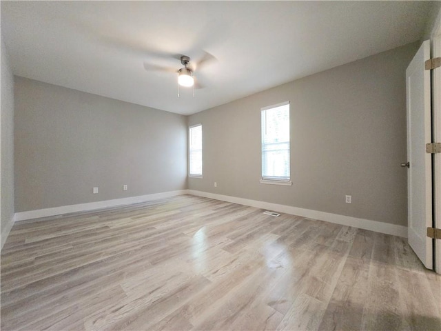 unfurnished room with light hardwood / wood-style floors and ceiling fan