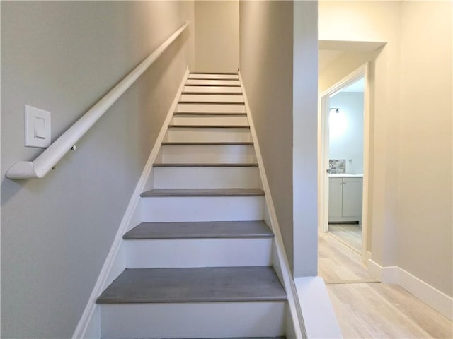 stairway with wood-type flooring