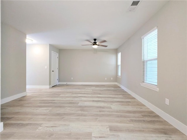 unfurnished room featuring light hardwood / wood-style floors and ceiling fan