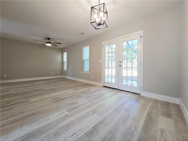 interior space with light hardwood / wood-style flooring, french doors, and ceiling fan