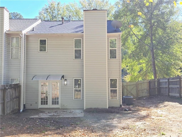 back of house featuring a patio, central AC, and french doors