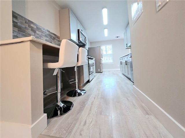 hallway featuring light wood-type flooring