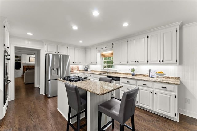 kitchen featuring appliances with stainless steel finishes and white cabinets