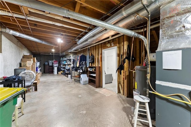 unfinished basement featuring water heater
