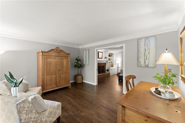 living room with dark wood-style flooring, a fireplace, a textured ceiling, baseboards, and ornamental molding