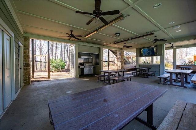 view of patio / terrace with ceiling fan and outdoor dining area