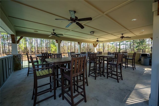 view of patio with a ceiling fan and outdoor dining area