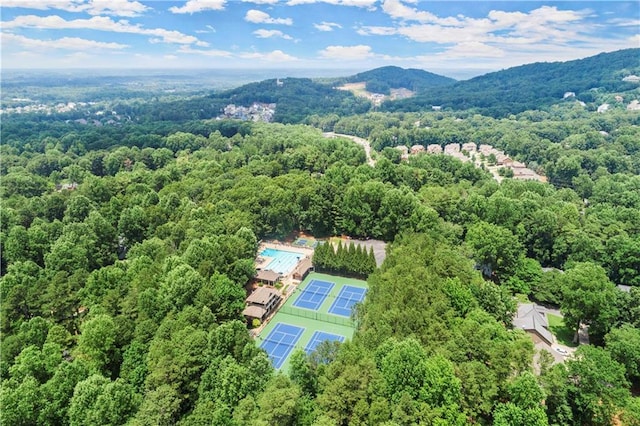 bird's eye view with a view of trees and a mountain view