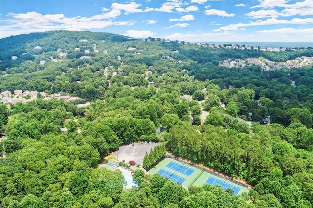 bird's eye view featuring a wooded view