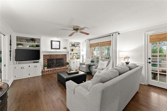 living room featuring ceiling fan, dark wood-style floors, and ornamental molding