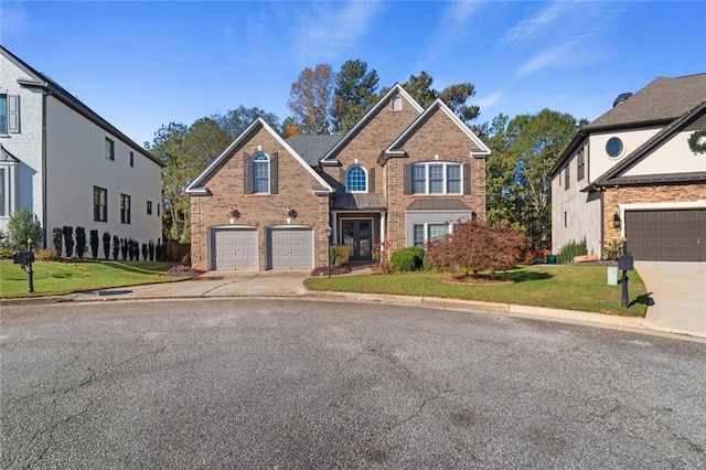 front facade with a garage and a front yard