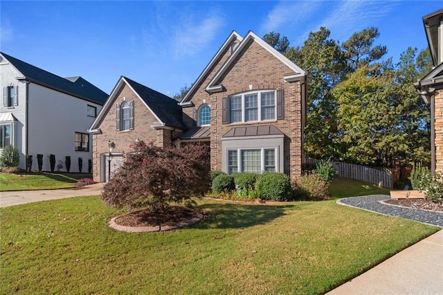 view of property featuring a front lawn