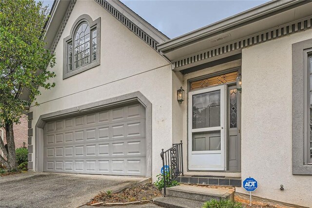 property entrance with a garage