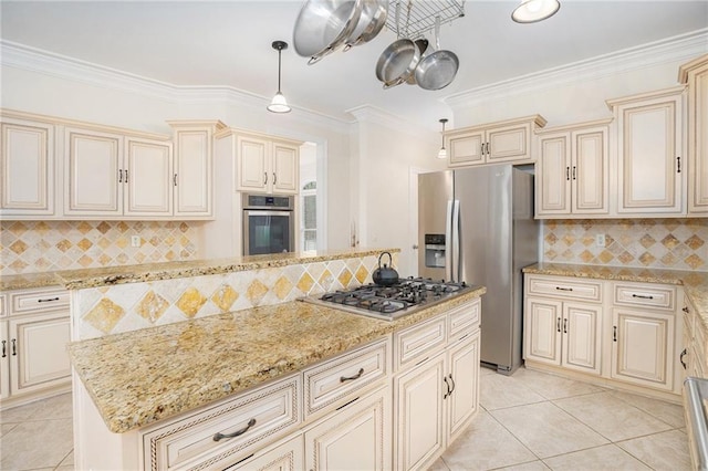 kitchen with appliances with stainless steel finishes, cream cabinets, light stone counters, and ornamental molding