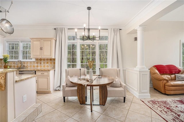 dining space featuring ornamental molding, plenty of natural light, and a chandelier