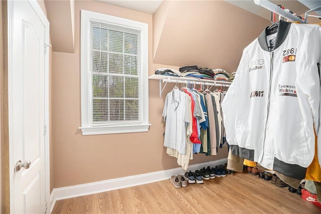 spacious closet with wood finished floors
