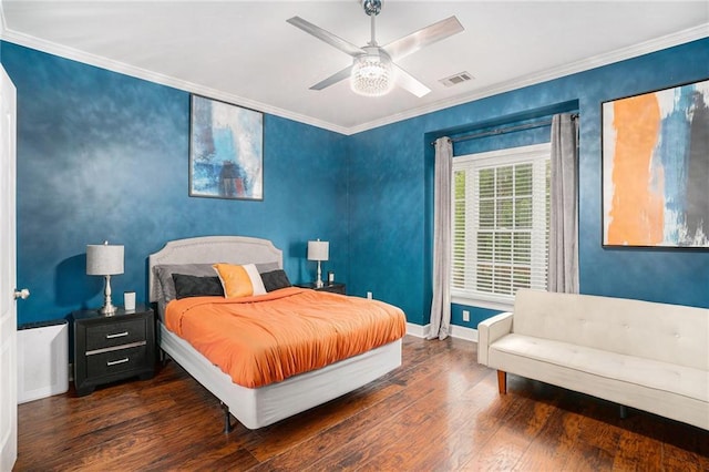 bedroom featuring baseboards, ornamental molding, a ceiling fan, visible vents, and hardwood / wood-style flooring