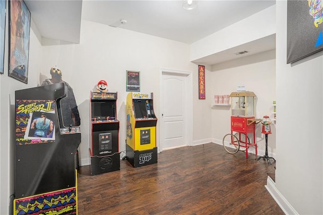 game room featuring wood finished floors, baseboards, and visible vents