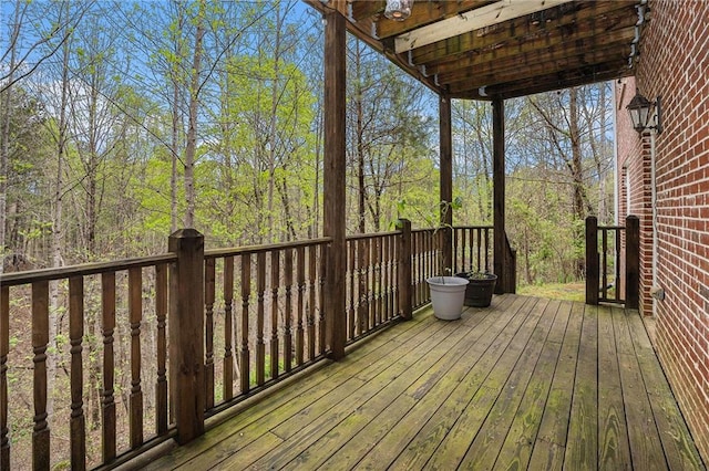 wooden deck featuring a view of trees