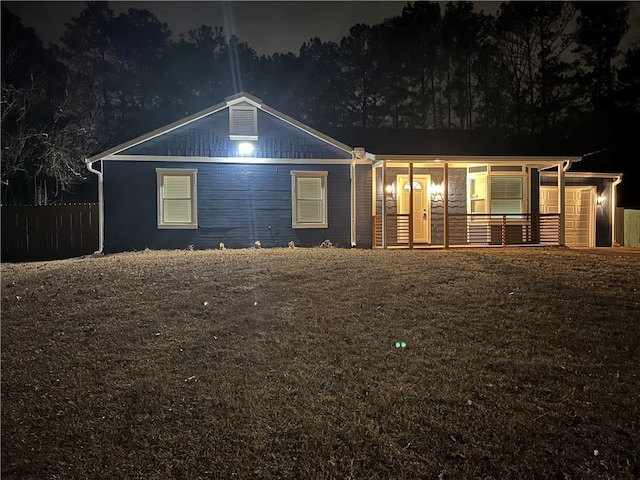 ranch-style home featuring a porch