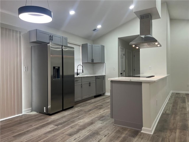 kitchen featuring stainless steel refrigerator with ice dispenser, dark wood-type flooring, sink, kitchen peninsula, and island exhaust hood