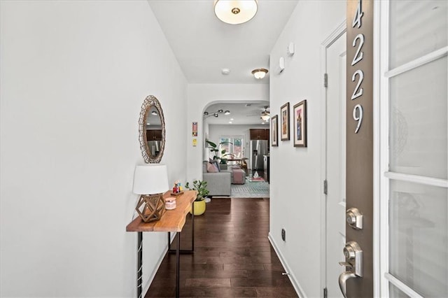 hall with dark hardwood / wood-style flooring