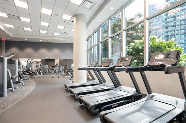 1080 Peachtree St NE Unit 804, Atlanta, GA 30309 - gym with healthy amount of natural light, a drop ceiling, and a high ceiling