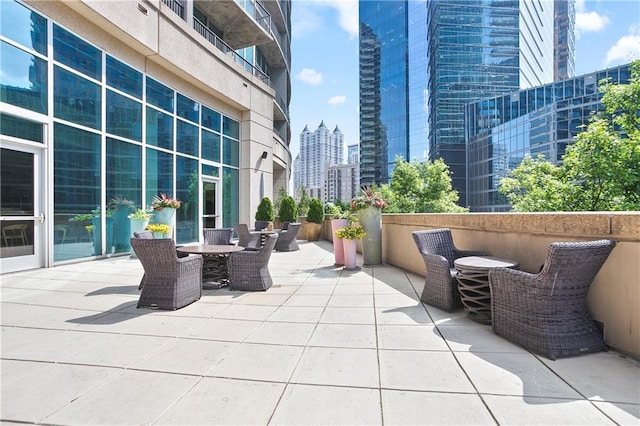 1080 Peachtree St NE Unit 804, Atlanta, GA 30309 - view of patio / terrace with a view of city and outdoor dining area