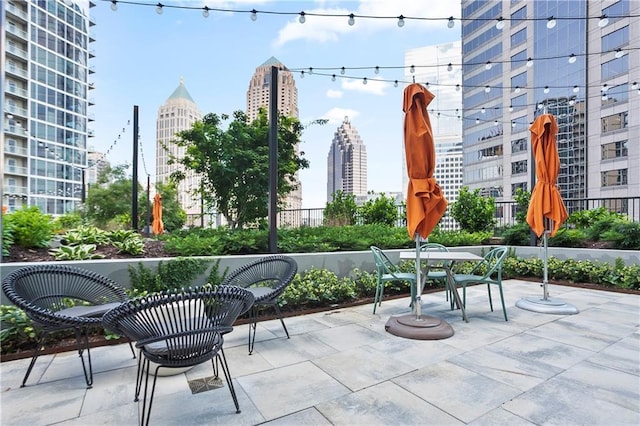 1080 Peachtree St NE Unit 804, Atlanta, GA 30309 - view of patio featuring a city view and outdoor dining area