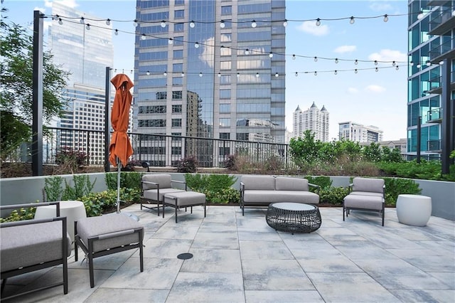 1080 Peachtree St NE Unit 804, Atlanta, GA 30309 - view of patio featuring a city view and outdoor lounge area