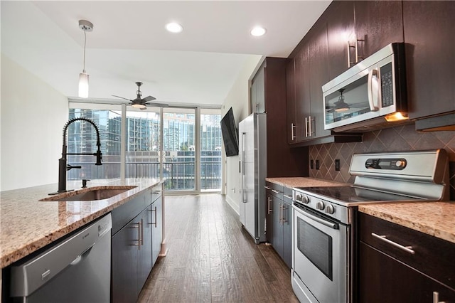 1080 Peachtree St NE Unit 804, Atlanta, GA 30309 - kitchen featuring stainless steel appliances, a ceiling fan, tasteful backsplash, dark wood-style floors, and dark brown cabinets