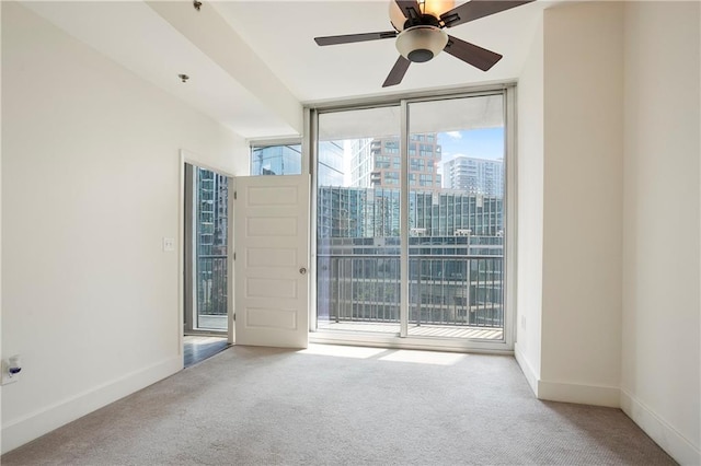 1080 Peachtree St NE Unit 804, Atlanta, GA 30309 - carpeted spare room featuring floor to ceiling windows, ceiling fan, and a view of city
