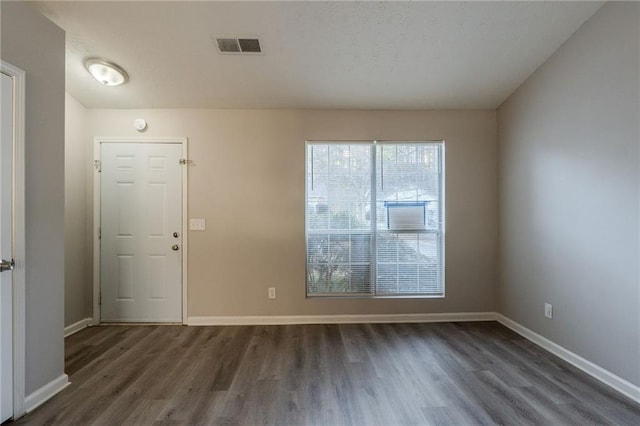 entryway with dark hardwood / wood-style floors