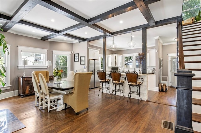 dining room with a wealth of natural light, coffered ceiling, dark wood-type flooring, and visible vents
