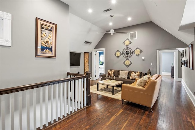 living area with ceiling fan, vaulted ceiling, dark wood-style floors, and visible vents