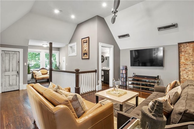 living room with visible vents, baseboards, dark wood-style flooring, and lofted ceiling