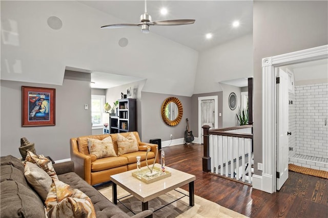 living area featuring wood finished floors, baseboards, ceiling fan, high vaulted ceiling, and recessed lighting