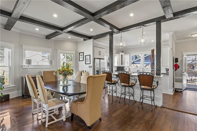 dining room with coffered ceiling, dark wood-style floors, and a wealth of natural light