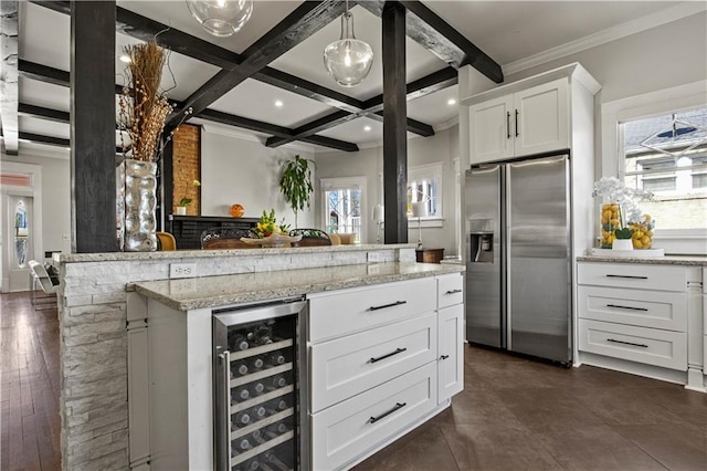 interior space with beverage cooler, beam ceiling, a healthy amount of sunlight, and stainless steel fridge with ice dispenser