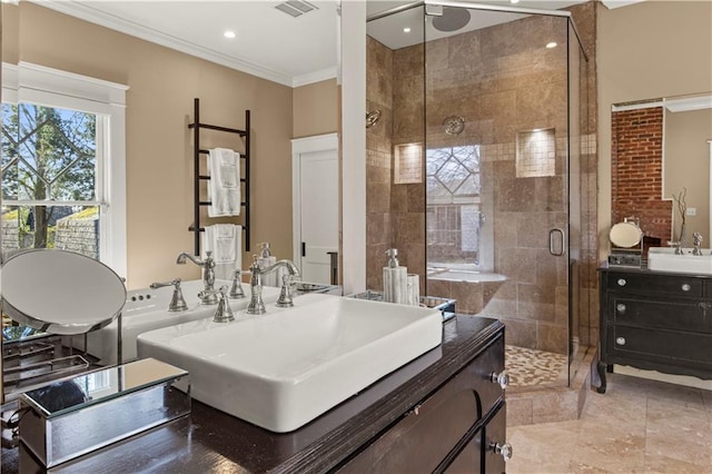 full bathroom featuring crown molding, ceiling fan, vanity, a shower stall, and visible vents