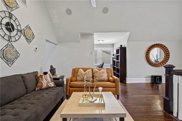 living room with baseboards, dark wood-style floors, vaulted ceiling, and visible vents