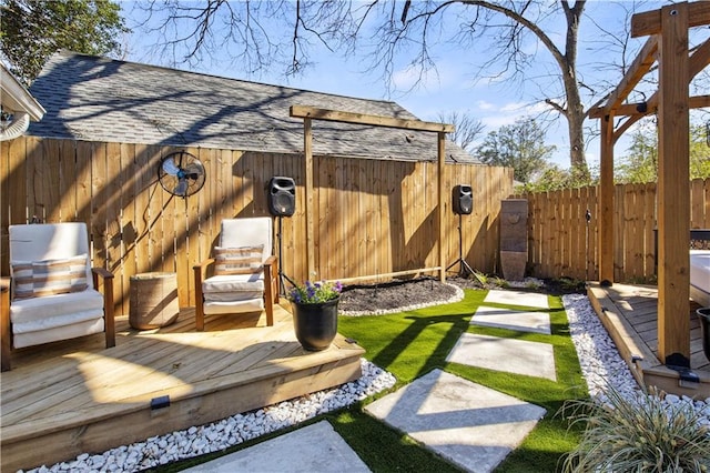 view of yard featuring a fenced backyard and a wooden deck