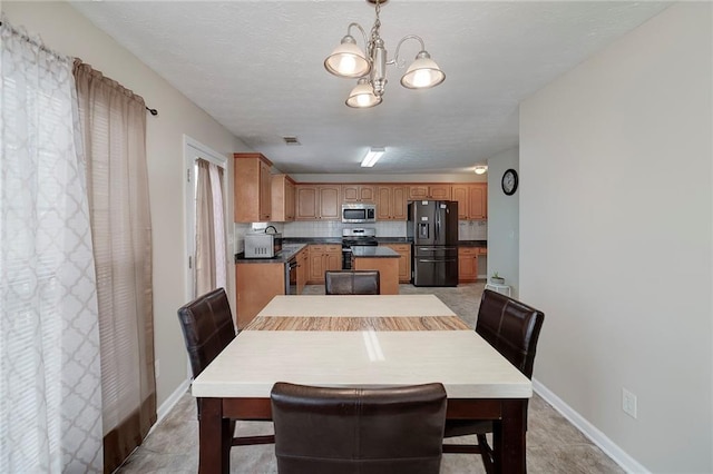 dining area featuring a chandelier