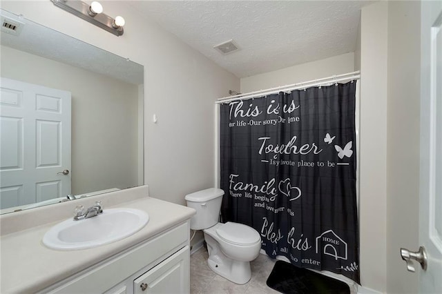 bathroom with tile patterned flooring, vanity, a textured ceiling, curtained shower, and toilet