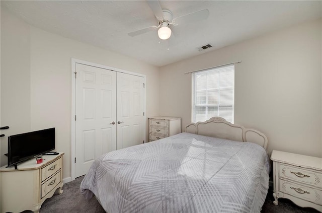 bedroom with carpet floors, a closet, and ceiling fan