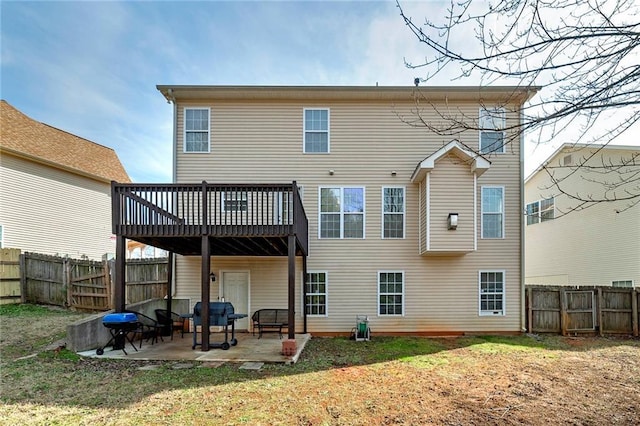 back of property featuring a patio and a yard