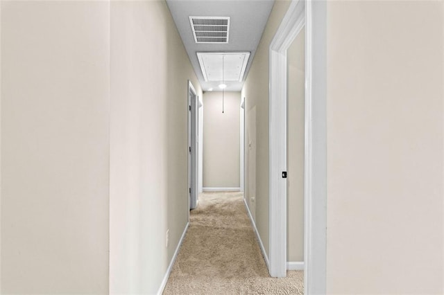 corridor featuring light carpet