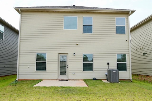 back of house with a patio area, a yard, and central air condition unit